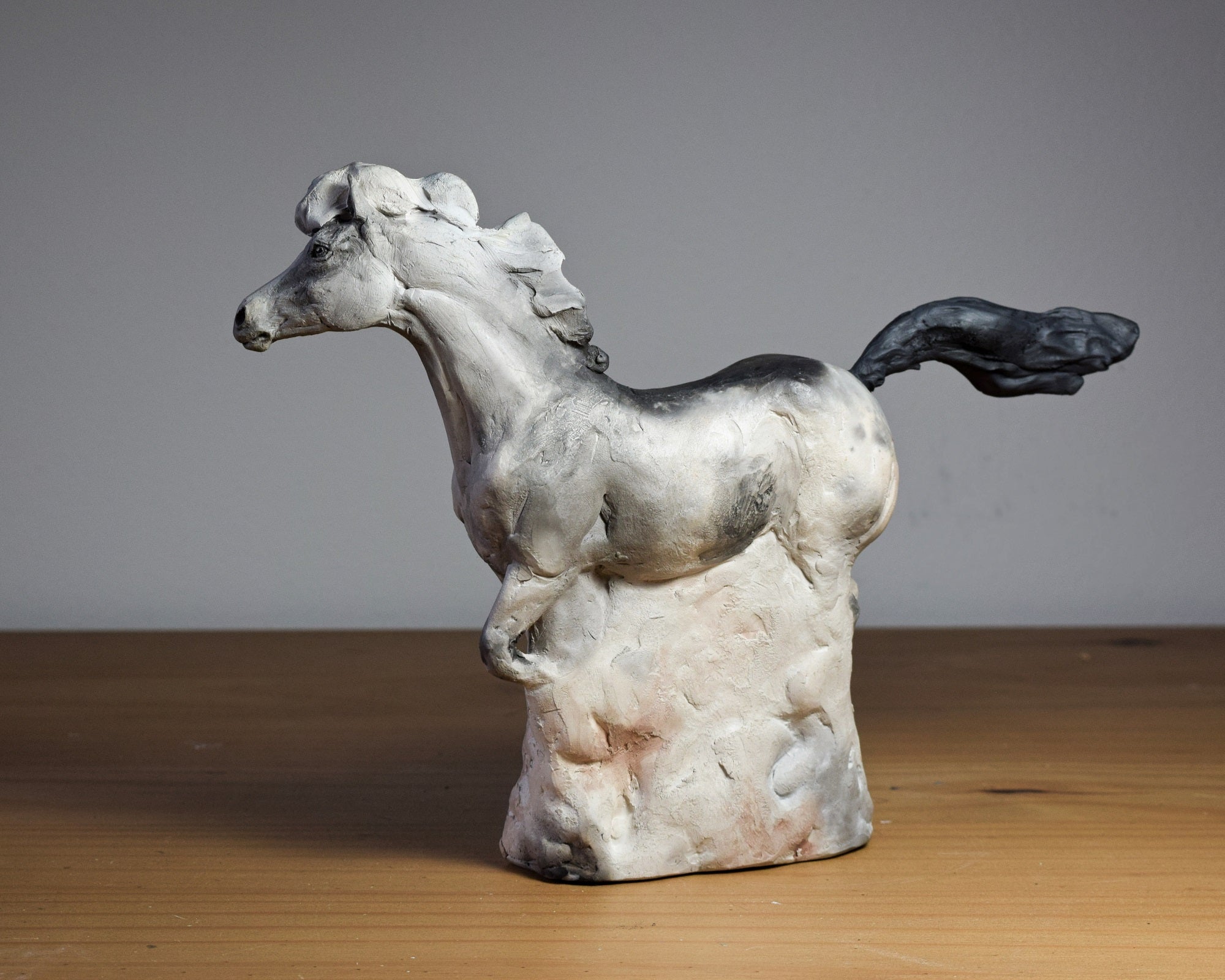 Smoke fired ceramic horse sculpture by Susie Benes