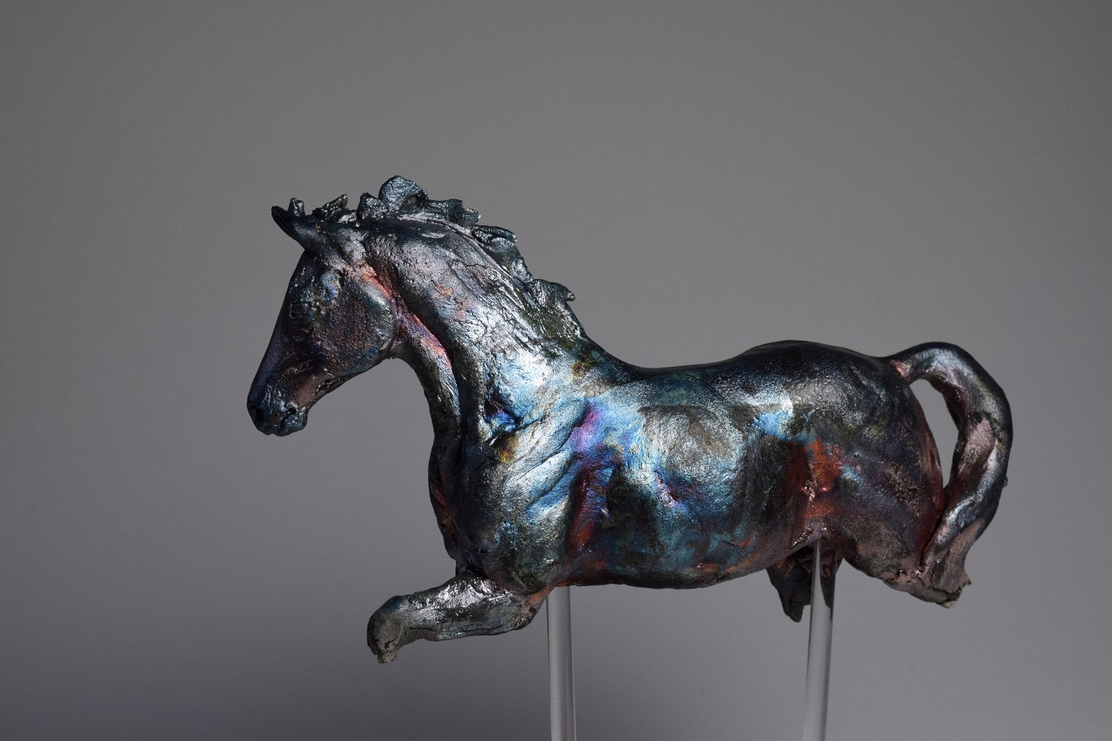 Ceramic raku horse sculpture Copper Dance by Susie Benes