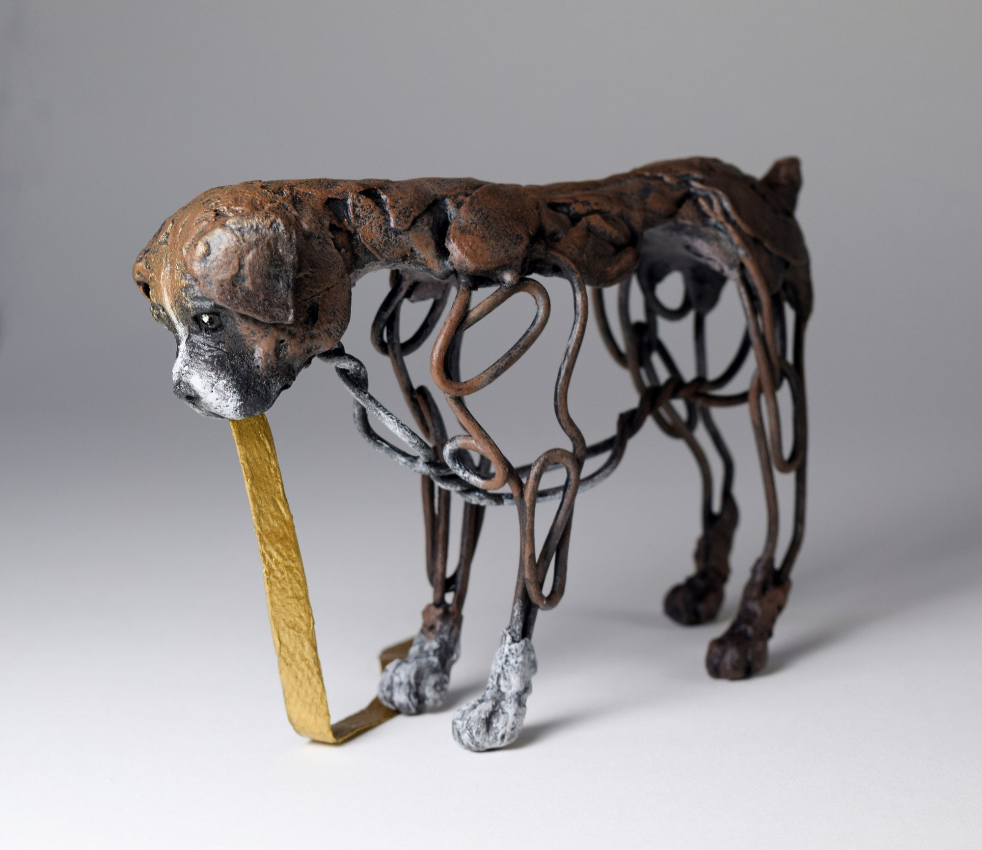 Air dry clay and wire boxer dog sculpture by Susie Benes