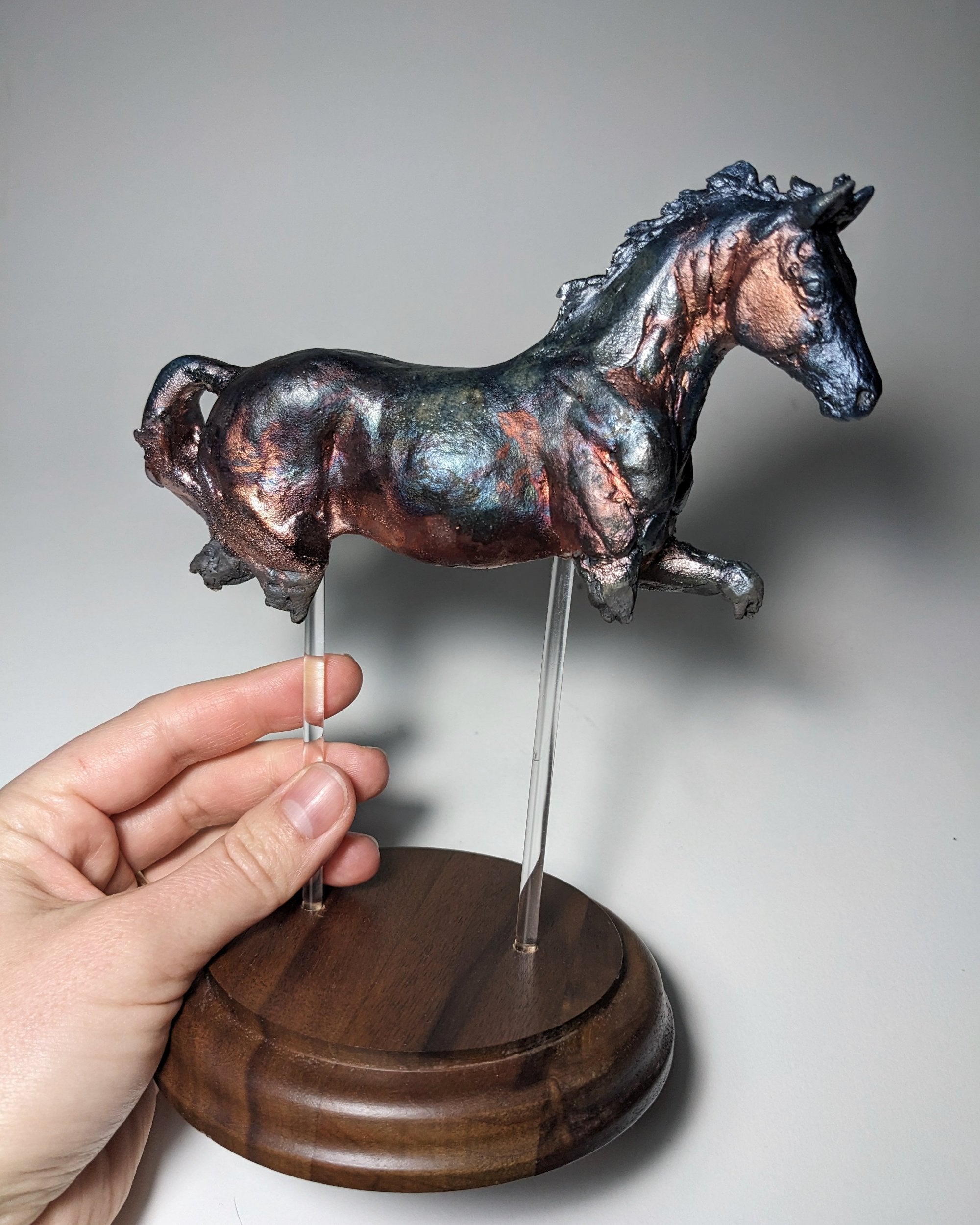 Metallic raku ceramic horse sculpture Copper Dance by Susie Benes