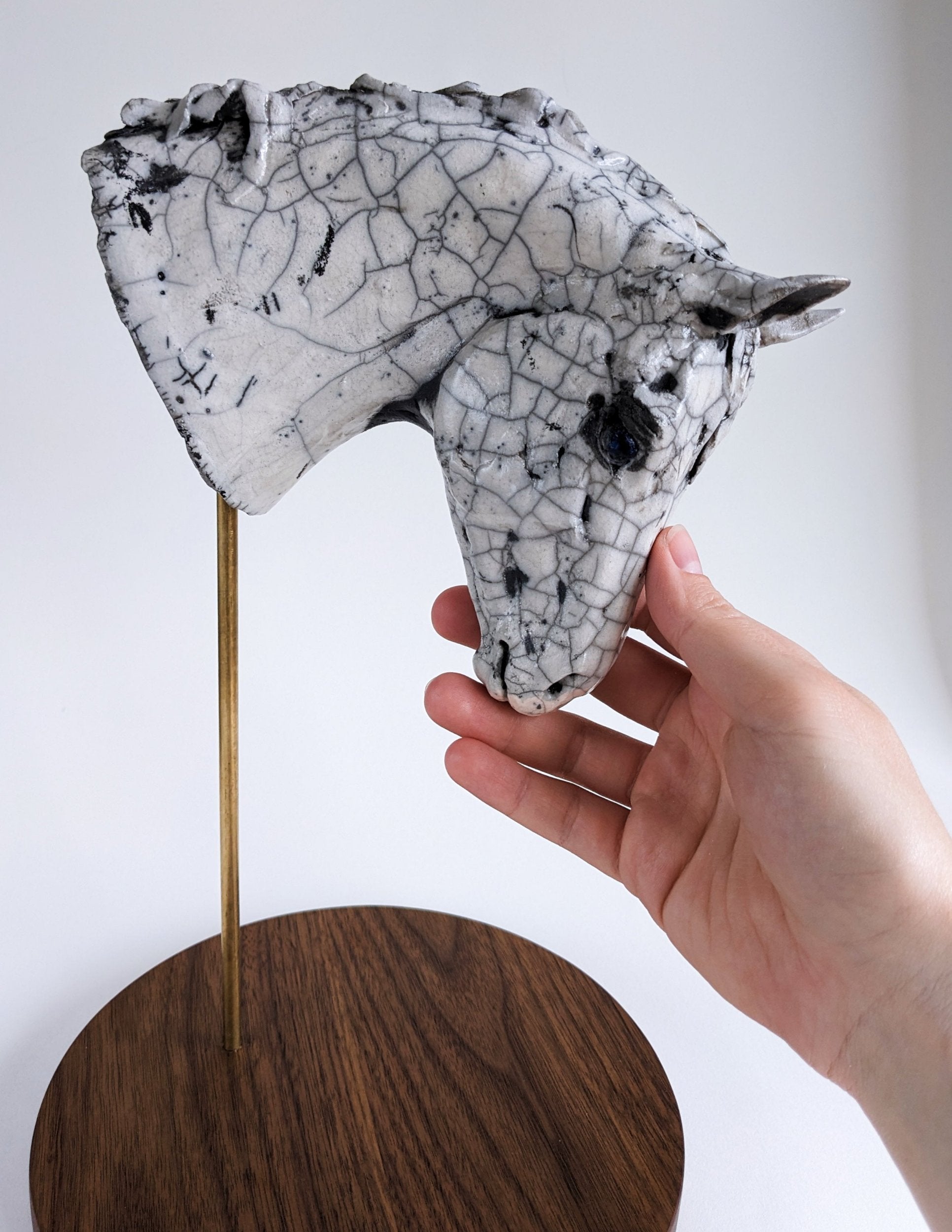 White crackle ceramic horse head sculpture by Susie Benes