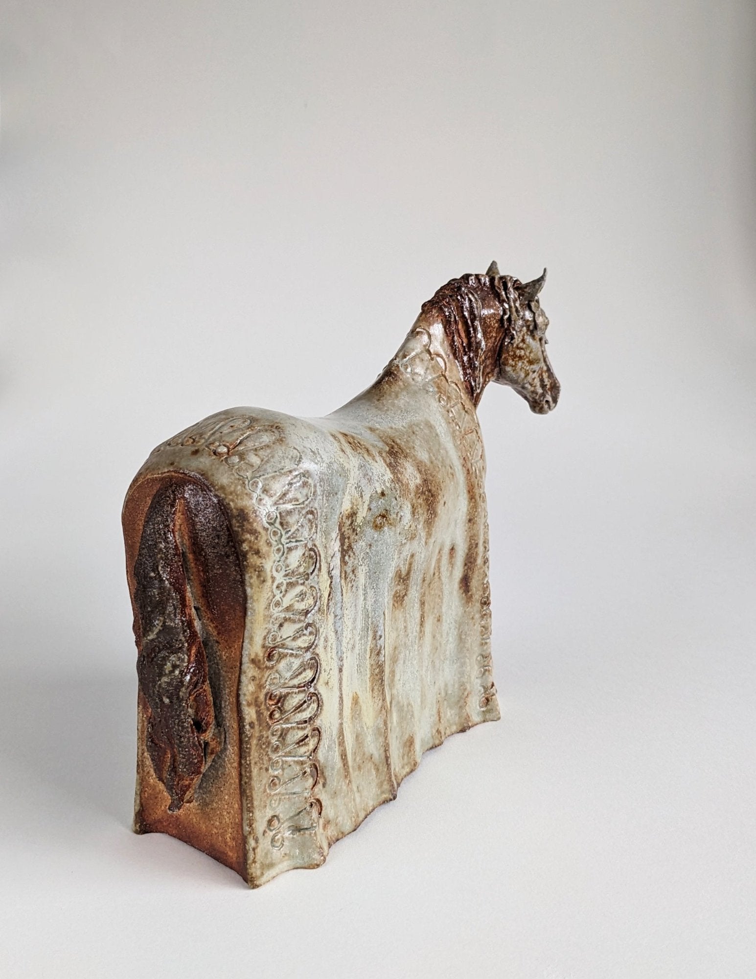 Wood fired ceramic horse with blanket sculpture by Susie Benes