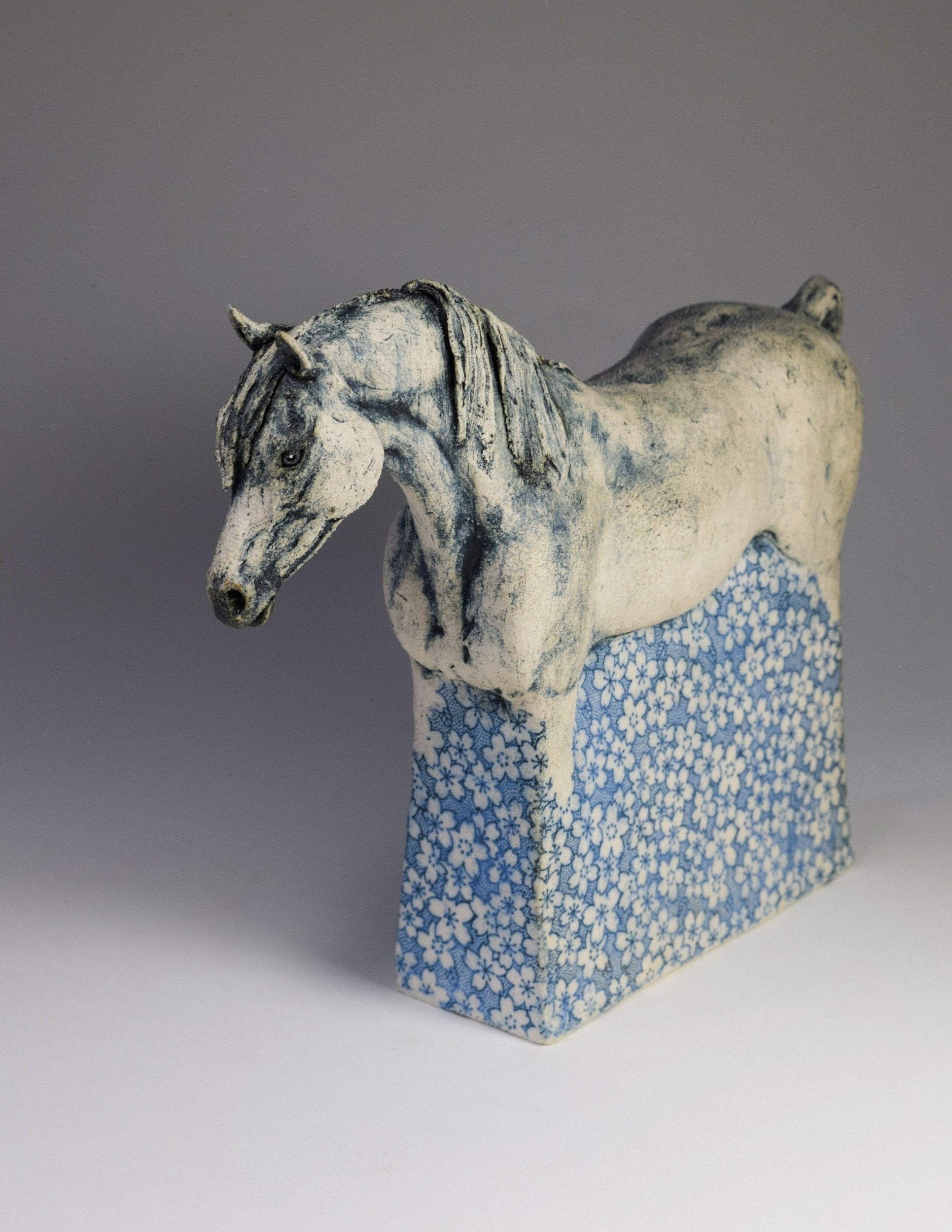 Ceramic horse sculpture with flower decals by Susie Benes