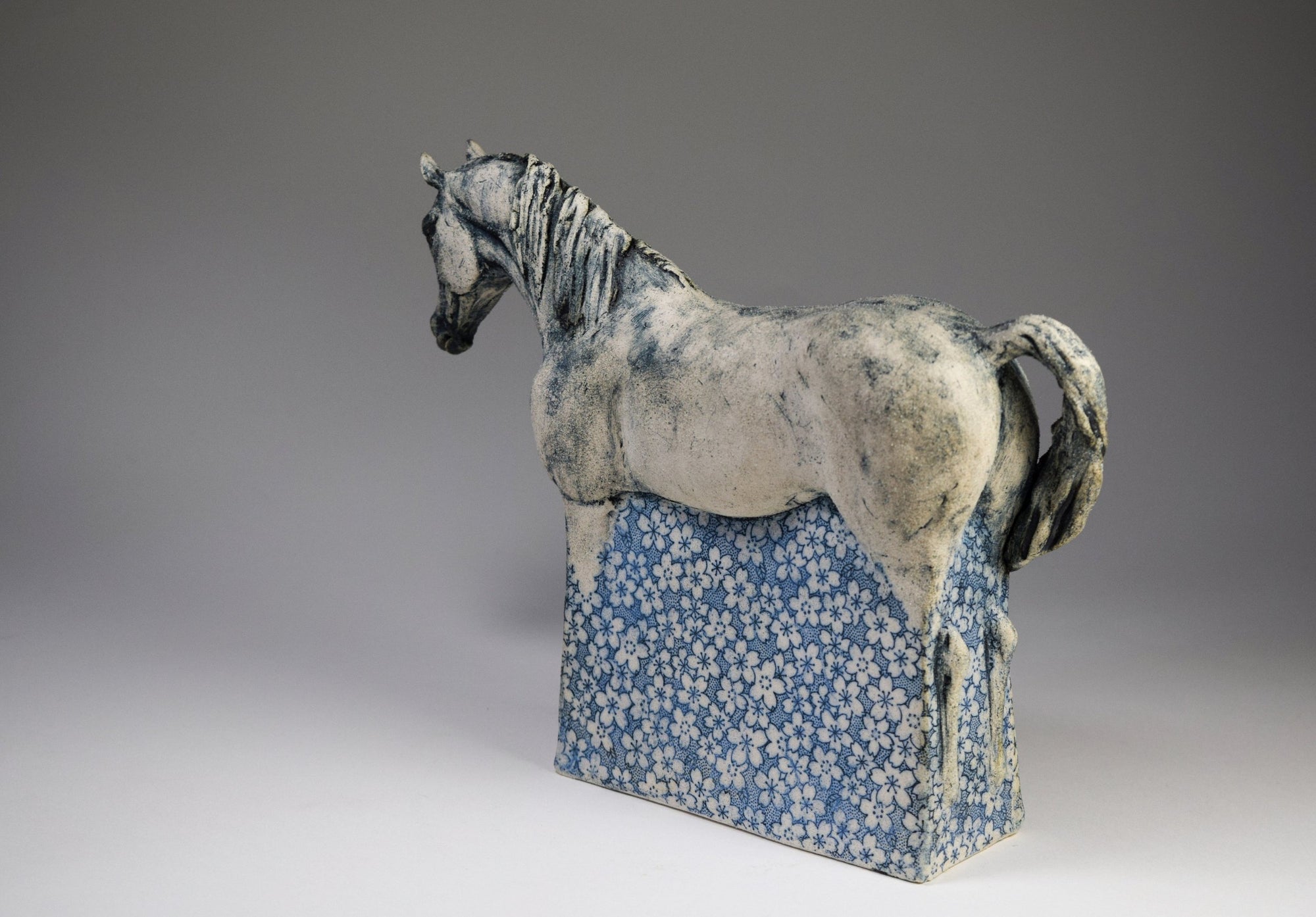 Ceramic horse sculpture with flower decals by Susie Benes