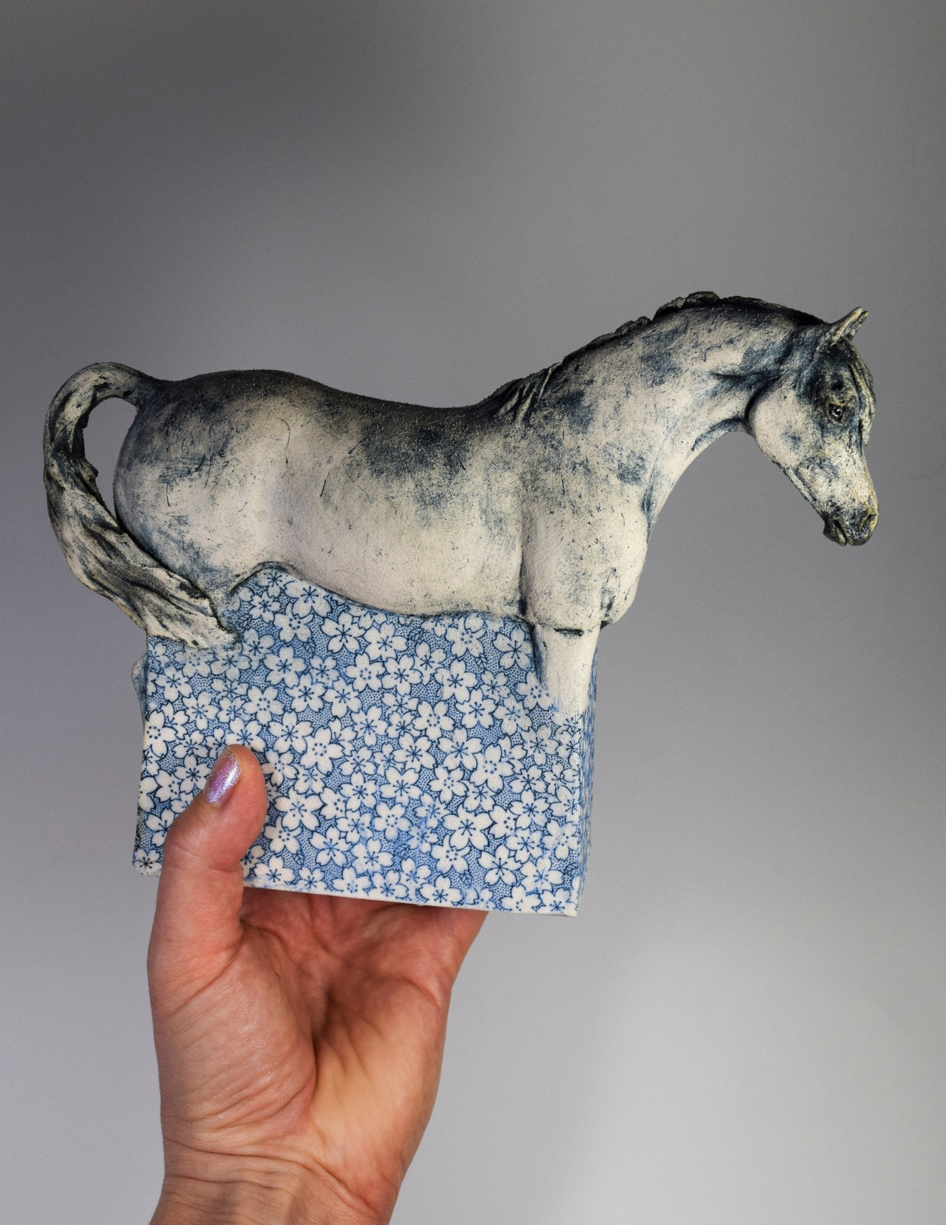 Ceramic horse sculpture with flower decals by Susie Benes
