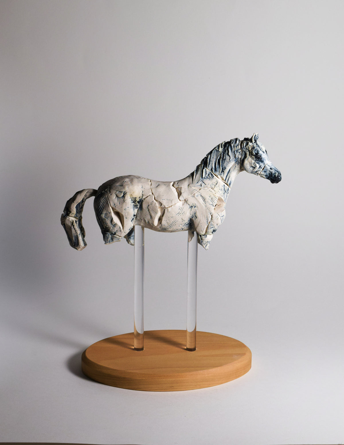 Porcelain horse sculpture by Susie Benes