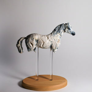 Porcelain horse sculpture by Susie Benes