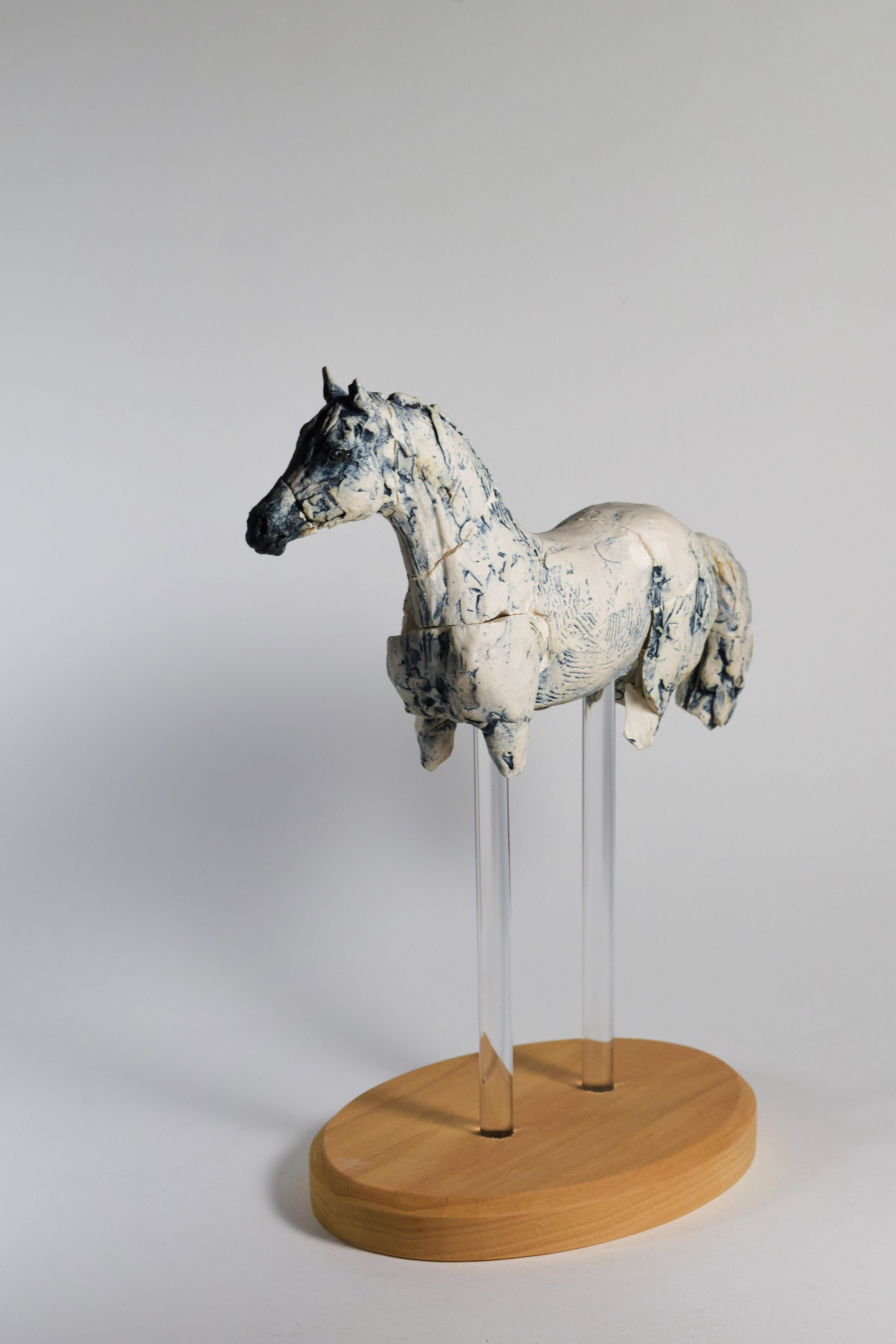 White porcelain horse sculpture by Susie Benes