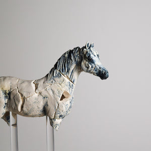 Porcelain horse sculpture by Susie Benes